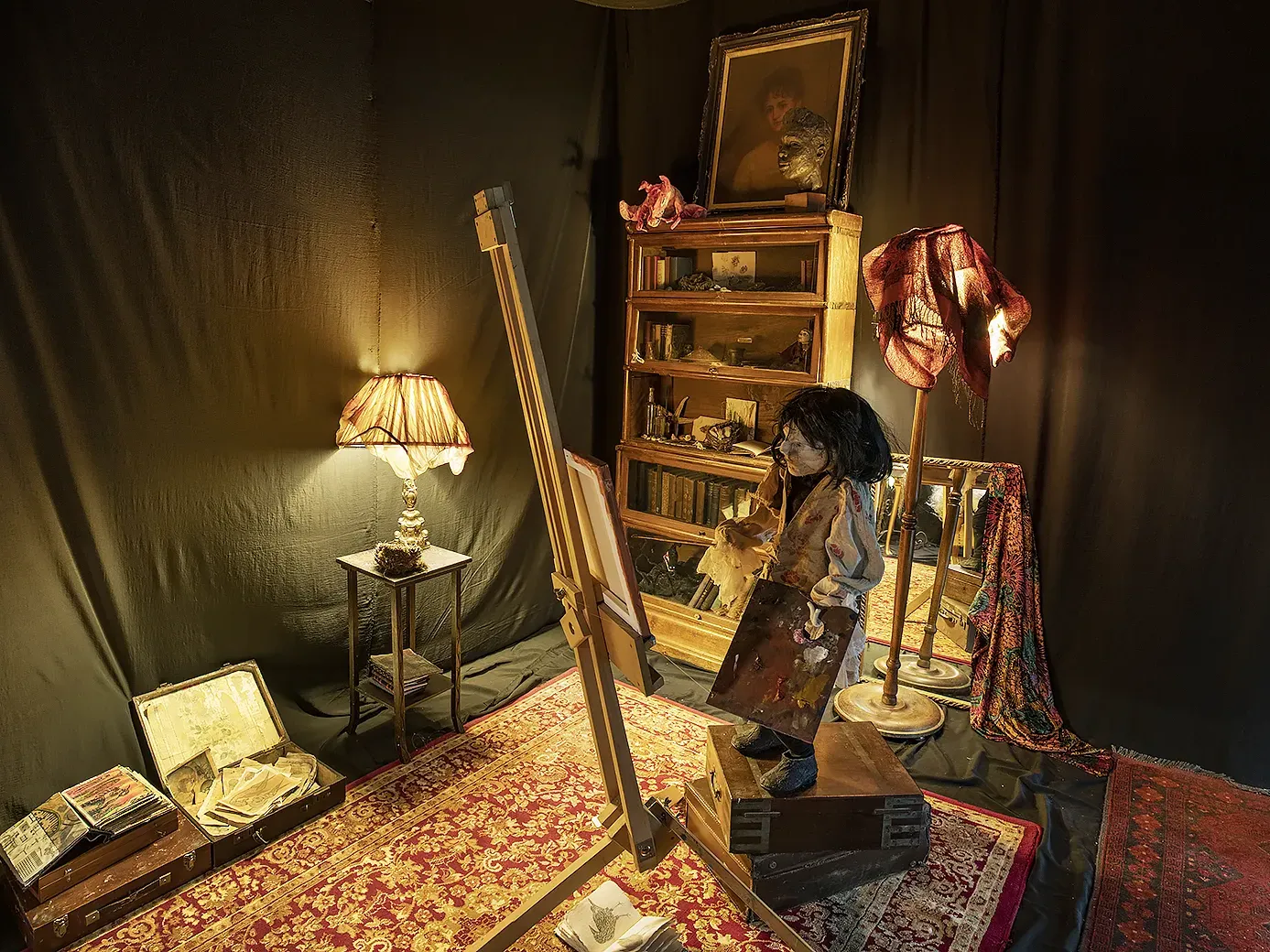 Male painter sculpture in his room.