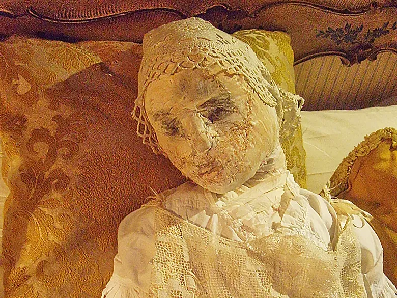 Woman in yellow bed close-up.