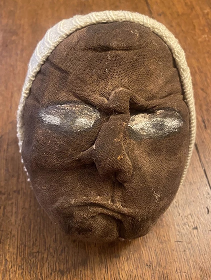 Soft head sculpture with black skin